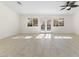 Living room with tile floor and French doors at 8229 Flowing Rapids Ct, Las Vegas, NV 89131