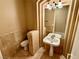 Elegant bathroom with pedestal sink, toilet, and tiled walls at 10008 Rolling Glen Ct, Las Vegas, NV 89117