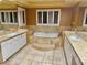 Main bathroom with double vanity and tub at 10008 Rolling Glen Ct, Las Vegas, NV 89117