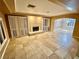 Spacious living room with fireplace and tiled floors at 10008 Rolling Glen Ct, Las Vegas, NV 89117