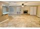 Living room with fireplace, tile floors and ceiling fan at 10008 Rolling Glen Ct, Las Vegas, NV 89117