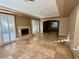 Spacious living room with fireplace and tile floors at 10008 Rolling Glen Ct, Las Vegas, NV 89117