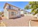 Gravel backyard with a view of the back of the house at 10168 Maidens Wreath Ct, Las Vegas, NV 89183