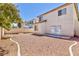 Small backyard with gravel and a view of the house at 10168 Maidens Wreath Ct, Las Vegas, NV 89183