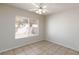 Bright bedroom with tile flooring and large window at 10168 Maidens Wreath Ct, Las Vegas, NV 89183