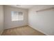 Simple bedroom with neutral walls, carpet, and a window at 10168 Maidens Wreath Ct, Las Vegas, NV 89183