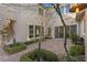 Relaxing courtyard oasis with brick pavers, greenery, and seating area at 11250 Torch Cactus Dr, Las Vegas, NV 89138