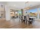 Bright dining room features hardwood floors and sliding glass doors to backyard at 11250 Torch Cactus Dr, Las Vegas, NV 89138