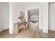 Bright and airy entryway with light hardwood floors, leading to the living room at 11250 Torch Cactus Dr, Las Vegas, NV 89138