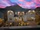 Two-story home with stone and siding exterior, welcoming front porch at 11250 Torch Cactus Dr, Las Vegas, NV 89138