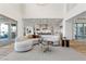 Living room with sectional sofa and view of the kitchen at 11250 Torch Cactus Dr, Las Vegas, NV 89138