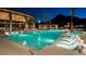 Expansive pool with comfortable lounge chairs and a mountain backdrop at 11250 Torch Cactus Dr, Las Vegas, NV 89138