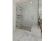 Large walk-in shower with glass enclosure and marble tile at 11250 Torch Cactus Dr, Las Vegas, NV 89138