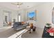 Relaxing sitting area featuring a gray sofa and a round wooden coffee table at 11250 Torch Cactus Dr, Las Vegas, NV 89138