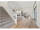 Elegant staircase with a modern white railing and herringbone carpet at 11250 Torch Cactus Dr, Las Vegas, NV 89138