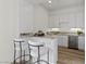 Modern wet bar with granite countertop, wine cooler, and stylish barstools at 11250 Torch Cactus Dr, Las Vegas, NV 89138