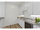 Modern wet bar with granite countertop and wine cooler at 11250 Torch Cactus Dr, Las Vegas, NV 89138