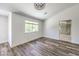 Main bedroom with wood-look floors and en-suite bathroom at 1516 Via Salaria Ct, Henderson, NV 89052