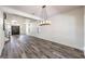 Elegant dining room with hardwood floors and a chandelier at 1516 Via Salaria Ct, Henderson, NV 89052