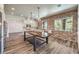 Modern kitchen with large island and exposed brick wall at 1516 Via Salaria Ct, Henderson, NV 89052