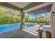 Covered patio with a pergola overlooking the pool and spa at 1516 Via Salaria Ct, Henderson, NV 89052