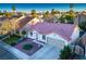 Attractive one-story home with terracotta tile roof at 1555 Bent Arrow Dr, North Las Vegas, NV 89031