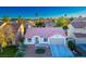 One-story house with terracotta roof and two-car garage at 1555 Bent Arrow Dr, North Las Vegas, NV 89031