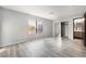 Well-lit bedroom featuring a mirrored closet and wood-look floors at 1865 Apricot Ct, Henderson, NV 89014