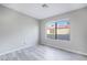 Spacious bedroom with large window and gray walls at 1865 Apricot Ct, Henderson, NV 89014