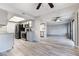 Open concept kitchen with stainless steel appliances and gray cabinets at 1865 Apricot Ct, Henderson, NV 89014