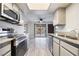 Bright kitchen with stainless steel appliances and view to living room at 1865 Apricot Ct, Henderson, NV 89014