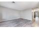 Bright living room with gray vinyl plank flooring at 1865 Apricot Ct, Henderson, NV 89014