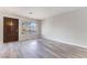 Living room with wood-look flooring and access to patio at 1865 Apricot Ct, Henderson, NV 89014