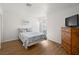 Bright bedroom featuring wood floors and large windows at 2214 Pebble Creek Ln, Laughlin, NV 89029