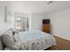 Bright bedroom featuring wood floors, a sliding glass door, and neutral wall color at 2214 Pebble Creek Ln, Laughlin, NV 89029