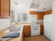 Well-lit kitchen featuring wood cabinets and stainless steel appliances at 2214 Pebble Creek Ln, Laughlin, NV 89029