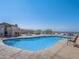 Community pool with seating at 2214 Pebble Creek Ln, Laughlin, NV 89029