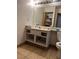 Bathroom with a vanity, toilet, and a mirror at 2961 Juniper Hills Blvd # 102, Las Vegas, NV 89142