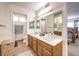 Bathroom with double vanity and a large mirror at 4705 Rockvale Dr, Las Vegas, NV 89103