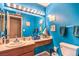 Small bathroom with blue walls and updated vanity at 4705 Rockvale Dr, Las Vegas, NV 89103