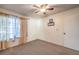 Simple bedroom with neutral decor and a large window at 4705 Rockvale Dr, Las Vegas, NV 89103