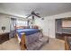 Primary bedroom with a king-size bed and sitting area at 4705 Rockvale Dr, Las Vegas, NV 89103