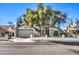 Single-story house with a gray garage door and a well-maintained lawn at 4705 Rockvale Dr, Las Vegas, NV 89103