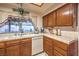 Well-equipped kitchen featuring wood cabinets and a tile backsplash at 4705 Rockvale Dr, Las Vegas, NV 89103