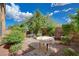 Private backyard oasis featuring a patio, grill, and mature plants at 5957 Pillar Rock Ave, Las Vegas, NV 89139