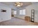 Bedroom with mirrored closet doors, ceiling fan, and neutral walls at 5957 Pillar Rock Ave, Las Vegas, NV 89139