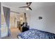 Cozy loft bedroom with a ceiling fan and window at 5957 Pillar Rock Ave, Las Vegas, NV 89139