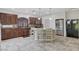 Kitchen with dark wood cabinets and an island at 5957 Pillar Rock Ave, Las Vegas, NV 89139