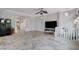 Living room with tile floor and large TV at 5957 Pillar Rock Ave, Las Vegas, NV 89139