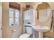 Small powder room with pedestal sink and toilet at 5957 Pillar Rock Ave, Las Vegas, NV 89139